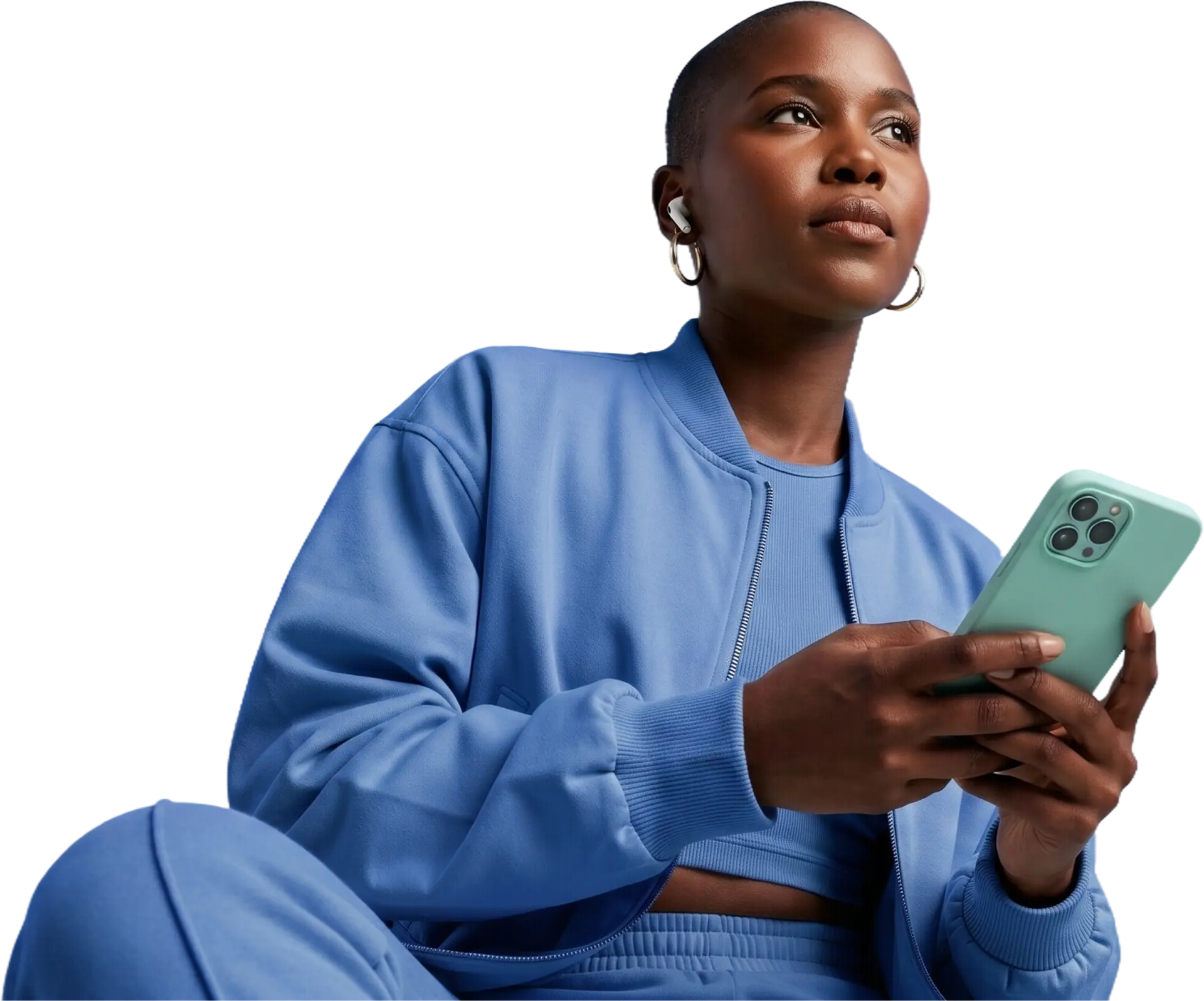 Woman in a blue tracksuit using the Giva app on her phone
